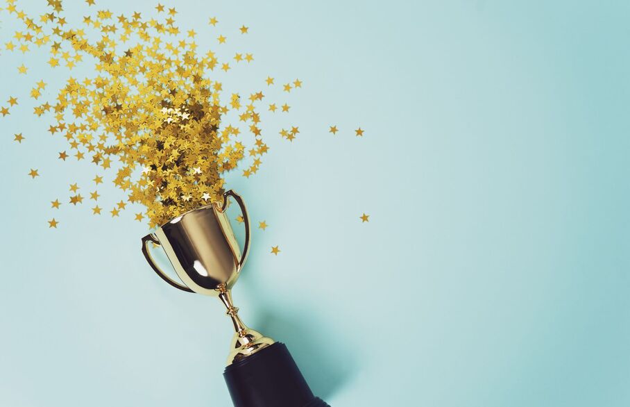 An award surrounded by confetti