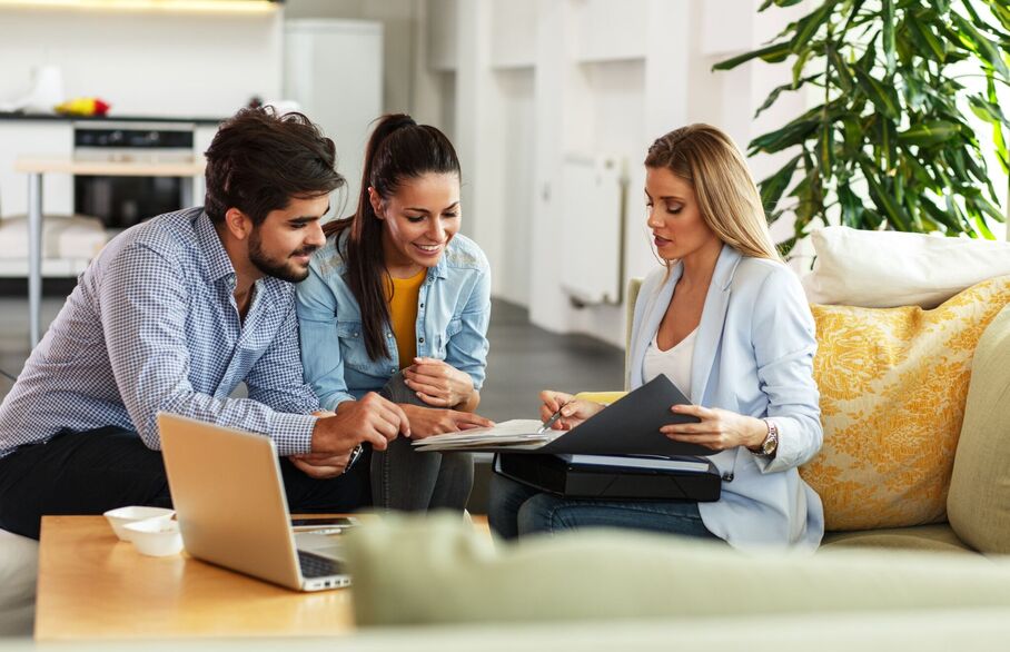 Three people having a meeting