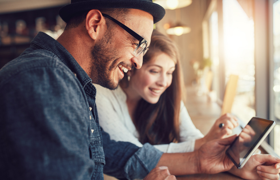 Two people looking at a phone