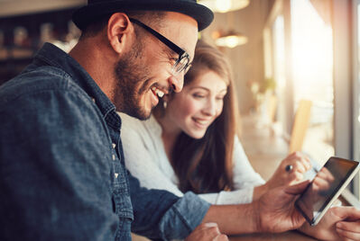 Two people looking at a phone