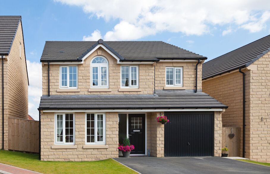 New Detached house with garden and black front and garage door