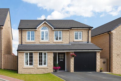 New Detached house with garden and black front and garage door