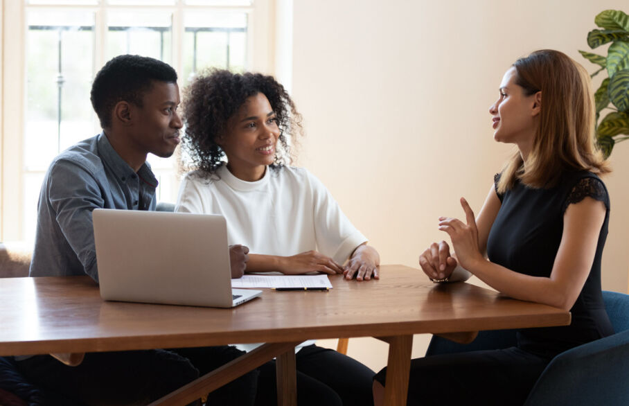 Three people having a meeting
