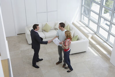 Three people viewing a house