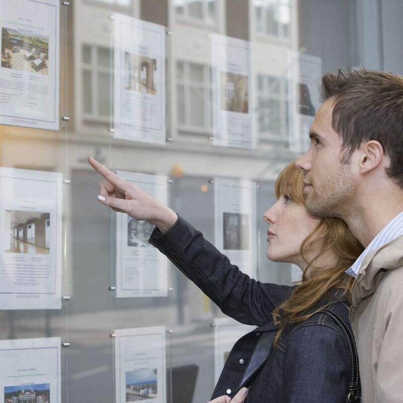 Buyers looking in a shop window