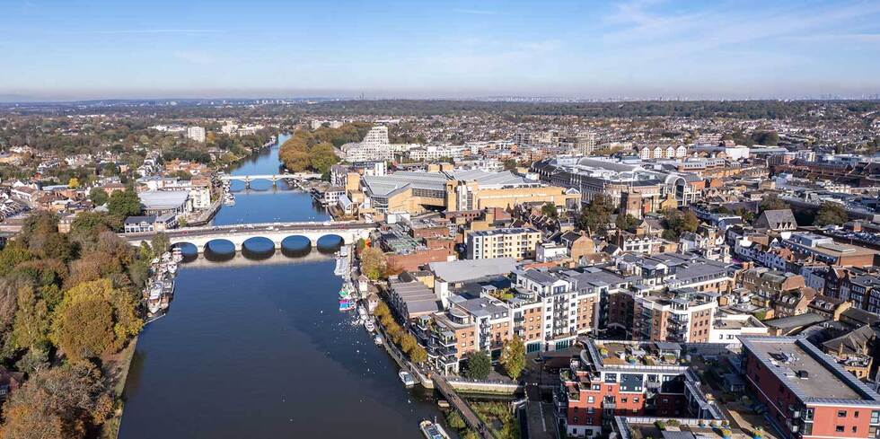 The drone aerial view of Kingston bridge across River Thames, and view of Kingston upon Thames, London.