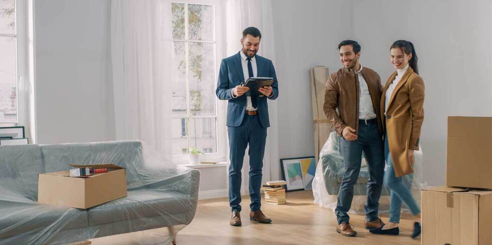 Agent with renters at a property viewing