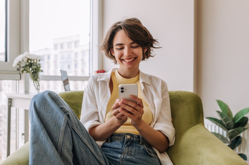 woman on phone getting alerts