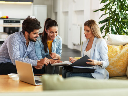 Couple meeting with estate agent