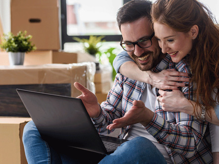 Young couple moving in new home.