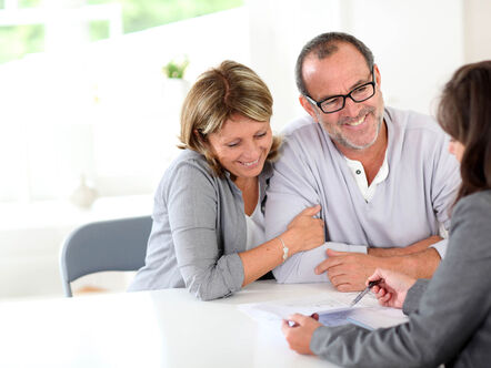 couple signing financial contract