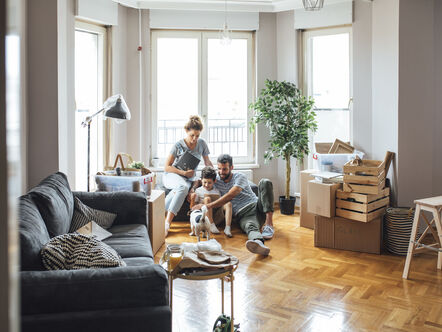 Husband and wife and their child moving in new home.