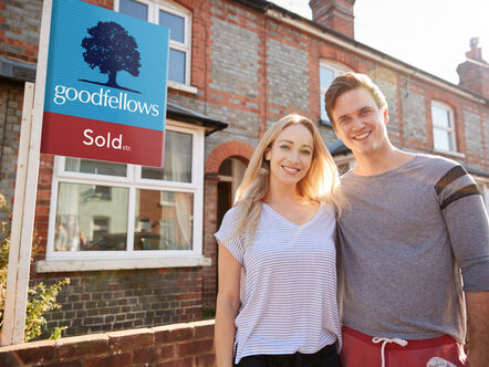 Couple with a Goodfellows sold board