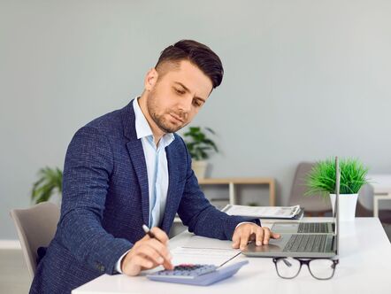 businessman with a calculator